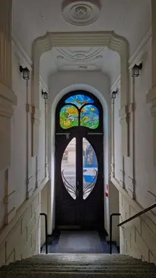 a door with a stained glass window in a hallway at Perfect Location Comfort Apartment City Beat#10 in Kraków