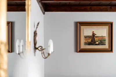 a picture of a man on a wall in a room at Starowiślna 37 Apartment with Mezzanine by BookingHost in Kraków