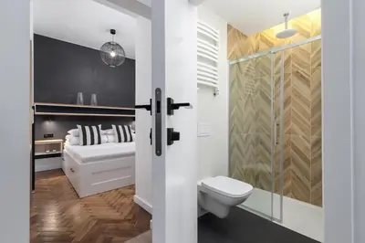 a bathroom with a toilet and a shower at Studio Apartment - Dietla 21 street in Kraków