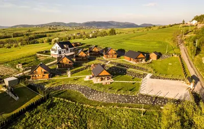 an aerial view of a village in a green field at Awesome Home In Slopnice With Sauna in Słopnice