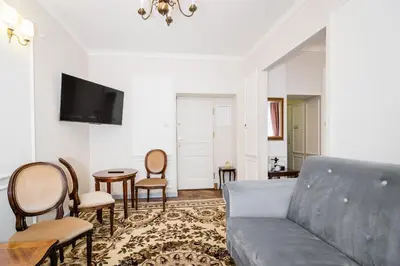 a living room with a couch and a table at Househost Apt: Starowiślna 75/3/1 in Kraków