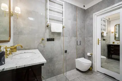 a bathroom with a sink and a toilet and a shower at Househost Apt: Starowiślna 75/3/1 in Kraków
