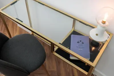a glass room with a chair and a lamp at Spacious & Modern 6 Bedroom Apartment - Around The Main Market Square - by Upstairs in Kraków
