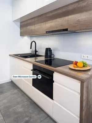 a kitchen with a plate of fruit on a counter at Industro Art Zablocie - Balcony - WiFi 1GB - 55