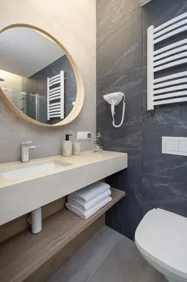 a bathroom with a sink and a mirror at Kazimierz Area - Dietla 21 street in Kraków
