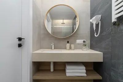 a bathroom with a sink and a mirror at Kazimierz Area - Dietla 21 street in Kraków