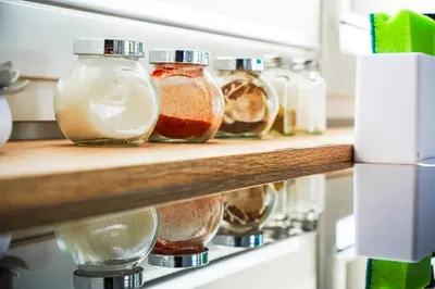 a row of glass jars on a shelf at Dom na Białych Brzóz pod Krakowem in Zabierzów