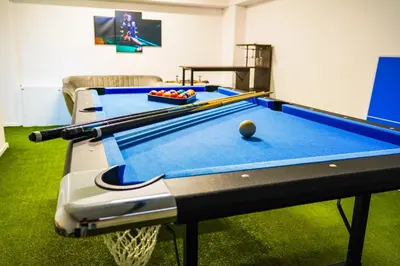 a room with a pool table with a ball on it at Dom na Białych Brzóz pod Krakowem in Zabierzów