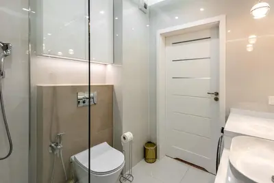 a bathroom with a toilet and a sink at ROYAL Deluxe 2 rooms 6 persons Aquapark Down Town in Kraków