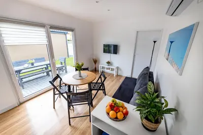 a living room with a couch and a table with fruit at Fantazja Resort Zator in Zator