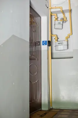 an open door to a room with a pump and a door at Balaton Apartamenty in Trzebinia
