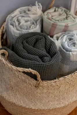a rattan basket with a snake in it at Ślusarska Modern Apartment with Balcony & Parking Cracow Zabłocie by Renters Prestige in Kraków