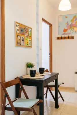 a dining room table with two bowls on it at Krowoderska 39 in Kraków