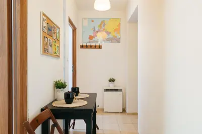 a small dining room with a table and chairs at Krowoderska 39 in Kraków