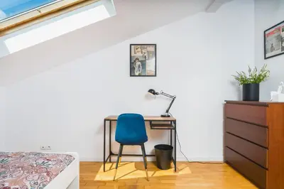 a bedroom with a desk and a bed at Unique Spacious 3 Bedroom Apartment - Old Town Loft - by Upstairs in Kraków