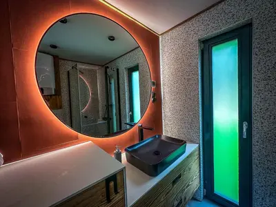 a bedroom with a bed in a room with wooden walls at 