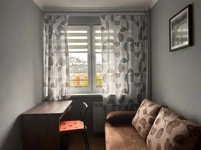 a couch in a living room with a ceiling at Apartament Center Starowiślna in Kraków