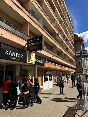 a group of people standing outside of a building at Apartament Center Starowiślna in Kraków