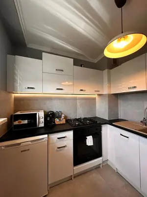 a coffee maker and a basket of water bottles at Apartament Center Starowiślna in Kraków