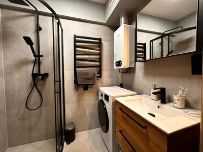 a bedroom with a bed and a window with curtains at Apartament Center Starowiślna in Kraków