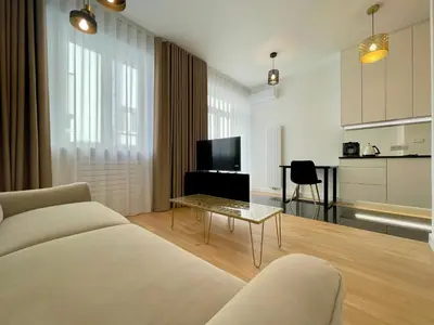 a bathroom with a sink and a mirror at Selected Apartments by market square in Kraków