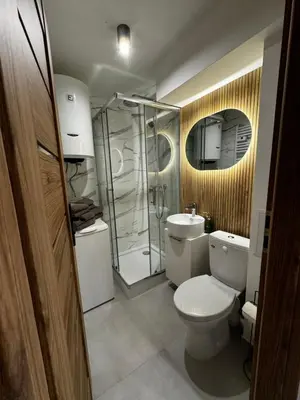 a bathroom with a toilet and a shower at Apartament na Orkana in Rabka-Zdroj