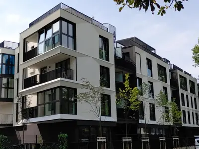an apartment building with black and white at Vistula Avenue Apartment free Parking in Kraków