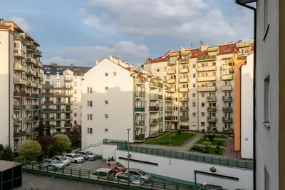 a view of some buildings from a window at Prokocim Podłęska Studio by BookingHost in Kraków