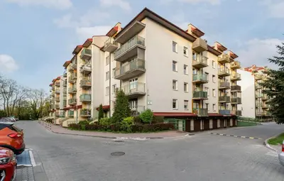 a large apartment building on the side of a street at Prokocim Podłęska Studio by BookingHost in Kraków