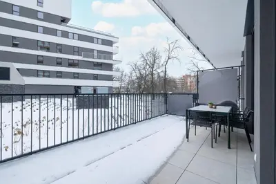 a balcony with a table and a building at Luxury Apartment near the City Center of Cracow by Renters Prestige in Kraków