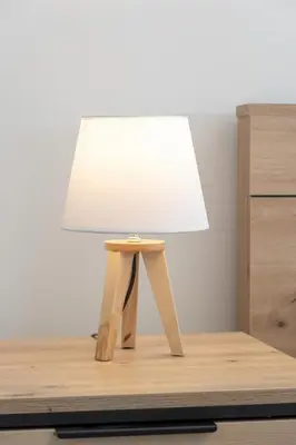 a table with a lamp on top of a dresser at Luxury Apartment near the City Center of Cracow by Renters Prestige in Kraków