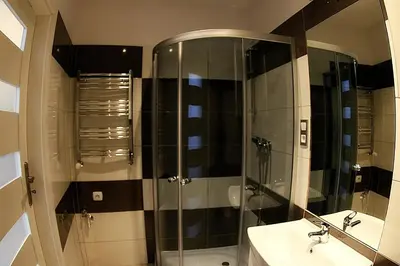 a bathroom with a shower and a sink at VisitKrak in Kraków