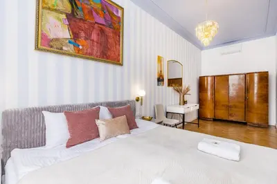 a living room with blue walls and a couch at BOB Elite Apartments in Kraków
