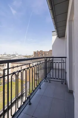 a balcony with a view of the city at Rakowicka Modern Studio in Downtown Cracow by Rent like home in Kraków