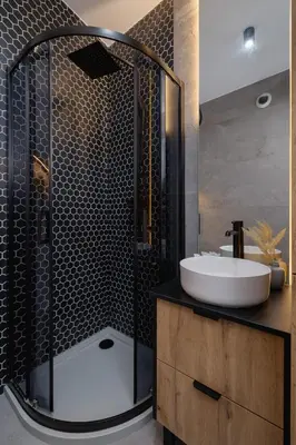 a bathroom with a shower with a sink and a toilet at Rakowicka Modern Studio in Downtown Cracow by Rent like home in Kraków