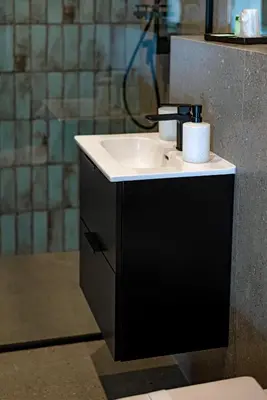a bathroom with a white sink and a shower at Willa Olimpia in Podzamcze