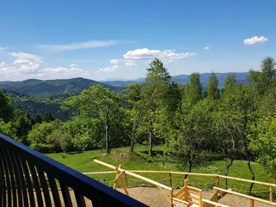 a view of the mountains from the deck of a house at Surzynówka in Stryszawa