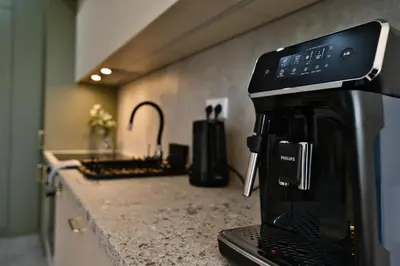 a microwave sitting on top of a kitchen counter at Apartament SUNSET 79 by Housine in Zator