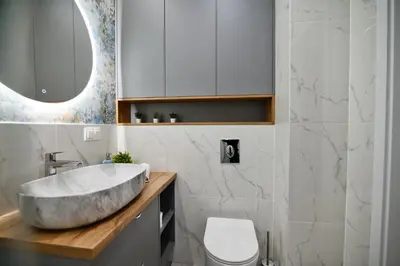 a bathroom with a concrete sink and a toilet at Apartament SUNSET 79 by Housine in Zator