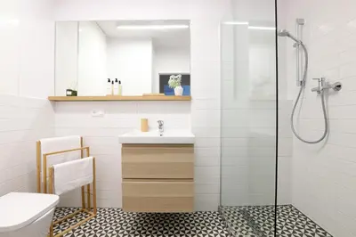 a bathroom with a sink and a shower at Malila Premium Apartments Cracow City Center Pawia 34 in Kraków