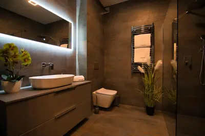 a bathroom with a sink and a toilet at Apartament Zator 5 by Housine in Zator