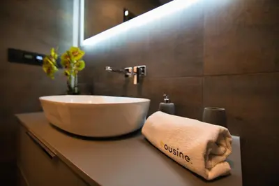a bathroom with a sink and a towel on a counter at Apartament Zator 5 by Housine in Zator