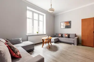 a living room with a couch and a table at Apartamenty Starowiślna 1, Kraków Main Square in Kraków