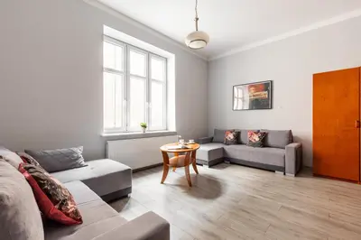 a living room with a couch and a table at Apartamenty Starowiślna 1, Kraków Main Square in Kraków