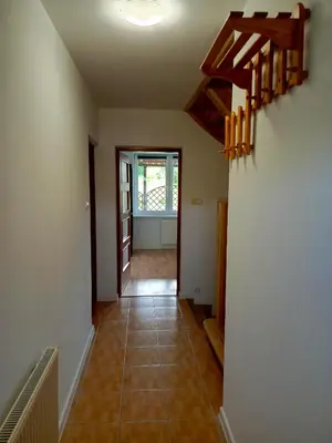 a hallway of a house with a staircase and a floor at W Rajbrocie u Ewusi in Rajbrot