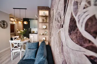 a living room with a couch and a table at Apartament Bulwary317 in Oświęcim