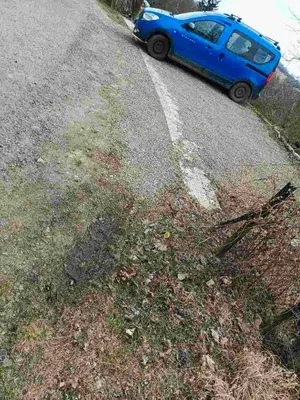 a blue car parked on the side of a road at Noclegi u Ewusi in Januszowice