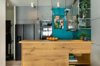 a kitchen with a counter with oranges on it at Miejska Cisza Urban Silence in Kraków