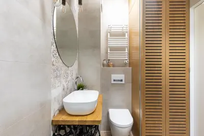 a bathroom with a sink and a toilet and a mirror at Miejska Cisza Urban Silence in Kraków