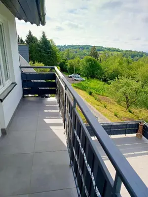 a balcony with a view of the countryside at Noclegi u Ewusi 2 in Januszowice
